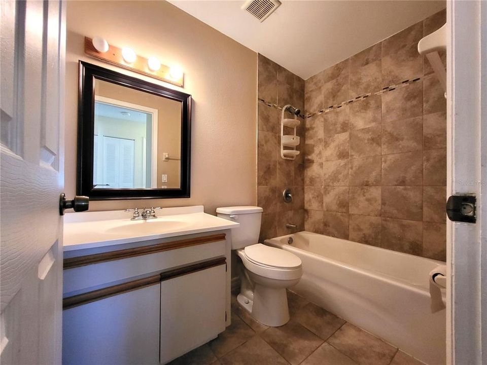 Guest bathroom with tub/shower combination.