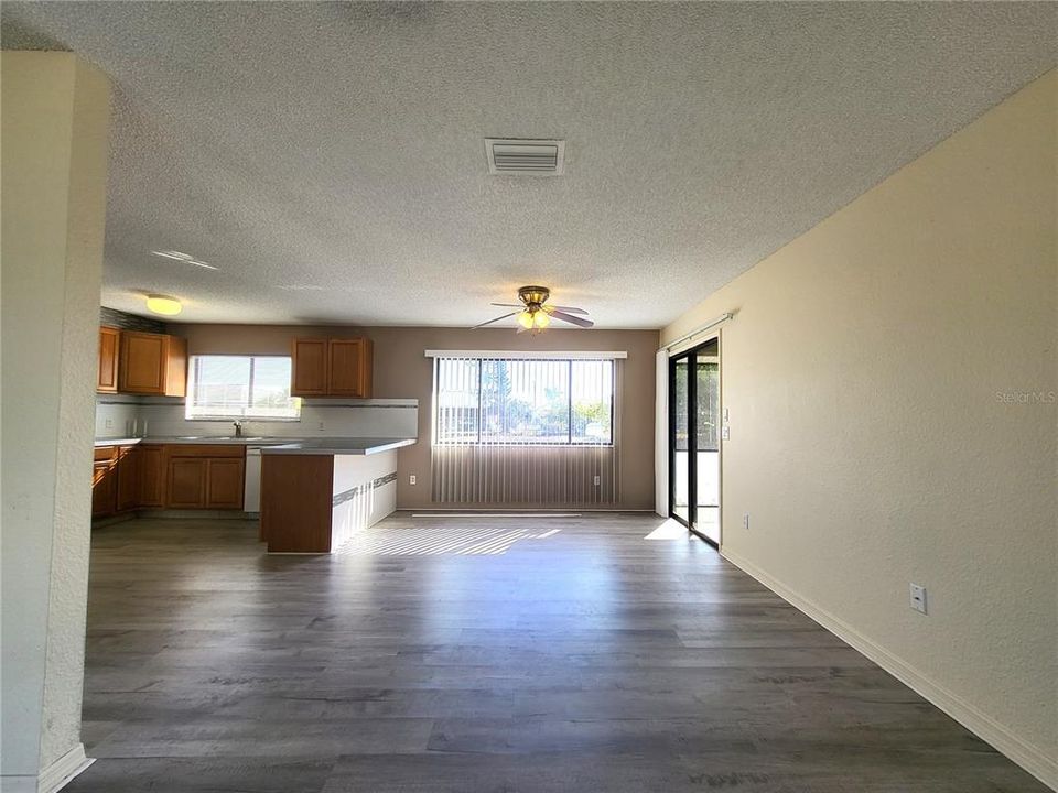 Living room opens to dining room and kitchen.