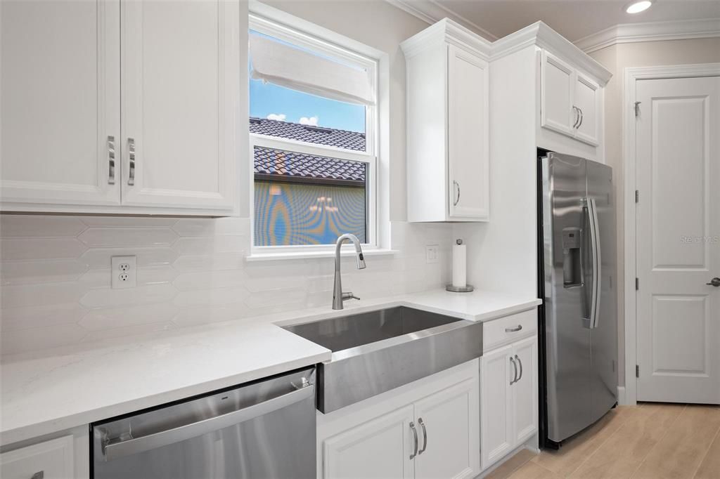 Tons of cabinets and counter space as well as a step in pantry to house all your cooking tools.