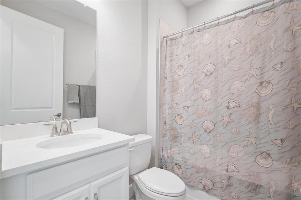 The front bathroom is perfect for guests, and
