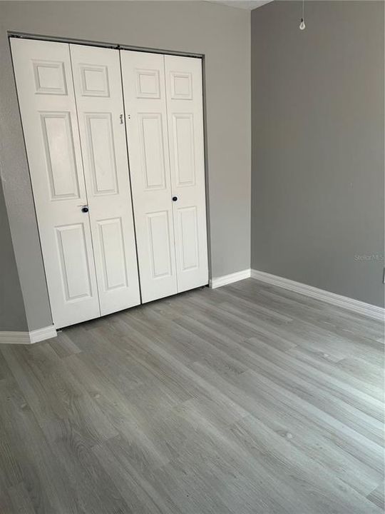 New flooring in the 3rd bedroom.