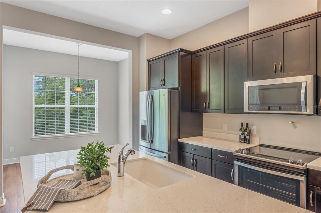 Kitchen with view of sitting area, dining area, and conservation