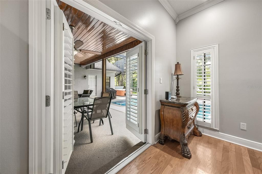 French Doors open from the Primary Bedroom to the Pool Area