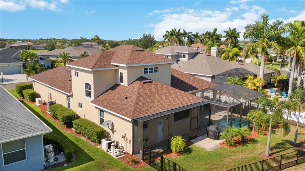 Brick paver driveway leading to oversized 2- car garage, has extra space for all your toys.