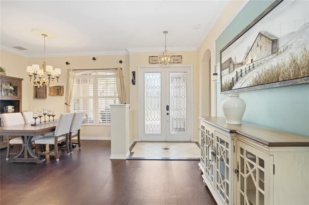 French doors bring natural light and elegance to spacious foyer.