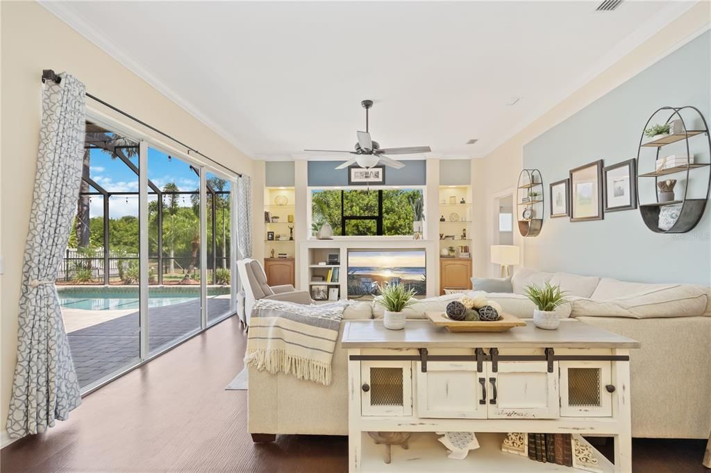 Beautiful open family room with plenty of natural light coming from pocket glass sliding doors and high ceilings.