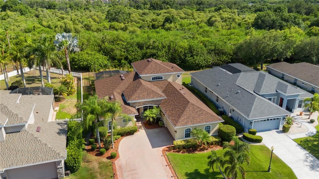 Tropical inspired landscaping with lush Florida palms creating great curb appeal. Welcome home to your relaxing Haven.