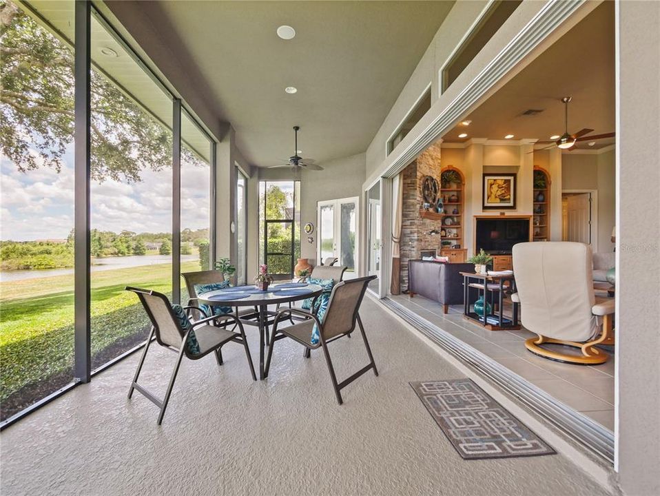 Sliding glass door retracts all the way into the wall to offer seamless living and outdoor transitions