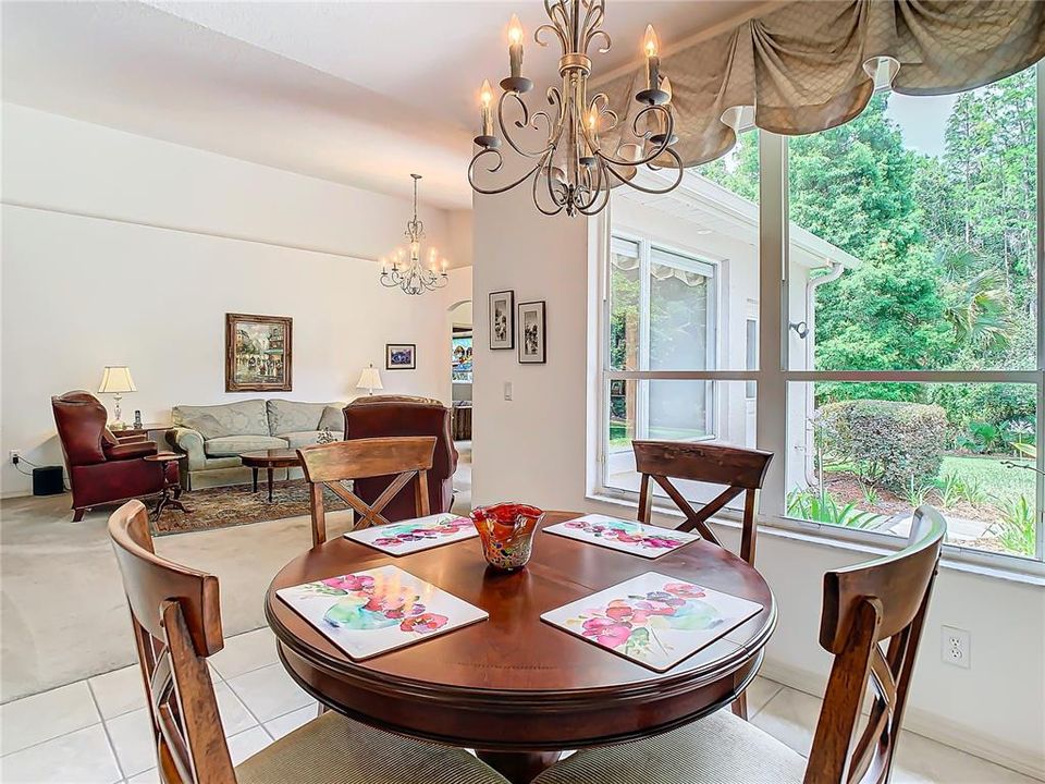 Breakfast nook overlooks the beautiful grounds outside.