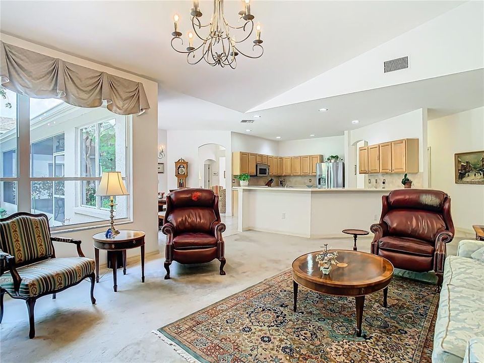 Family room with high ceilings and large windows