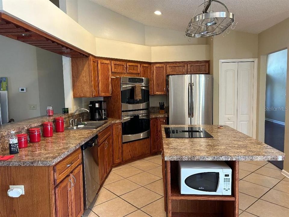 Open kitchen, stainless appliances