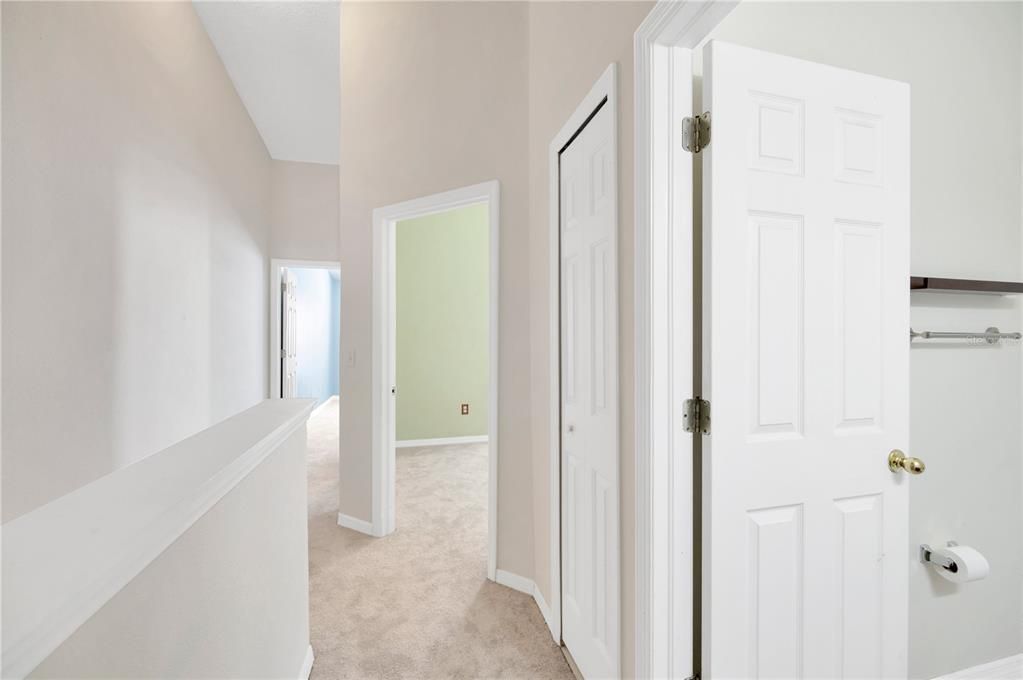 View from Primary Suite looking to the east to the two secondary bedrooms and shared bathroom.