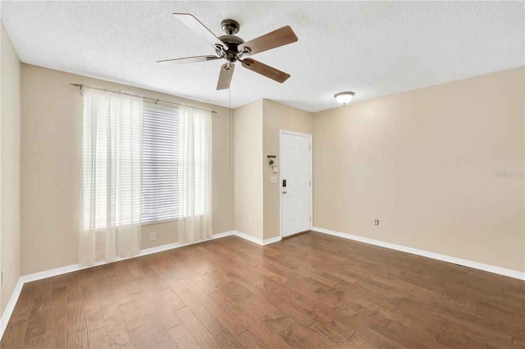 Check out the beautiful hand scraped, wide planked, engineered hardwood throughout the 1st floor.  The living/dining room is 20 x 11’ with a neutral wall color and plenty of natural light.