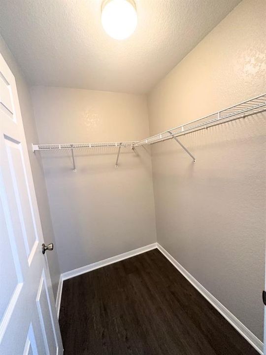 Primary walk-in closet.