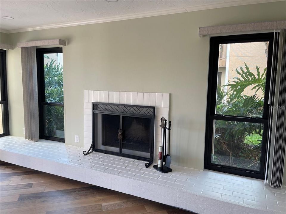 Fireplace between impact resistant side windows