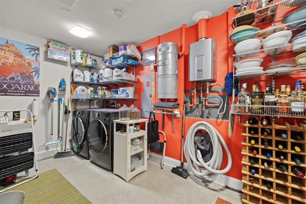 A walk-in pantry large enough to host the laundry area. Propane fuels the tankless hot water heater and gas cooktop. A central vacuum system for effortless cleaning.