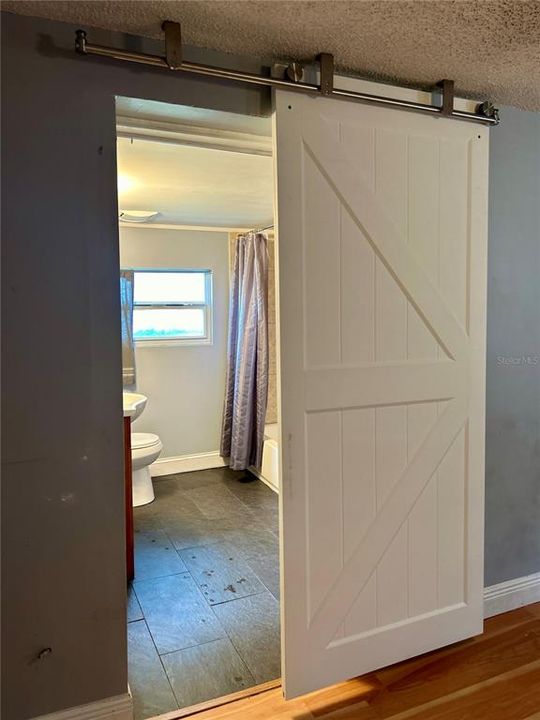 barn door to master bathroom