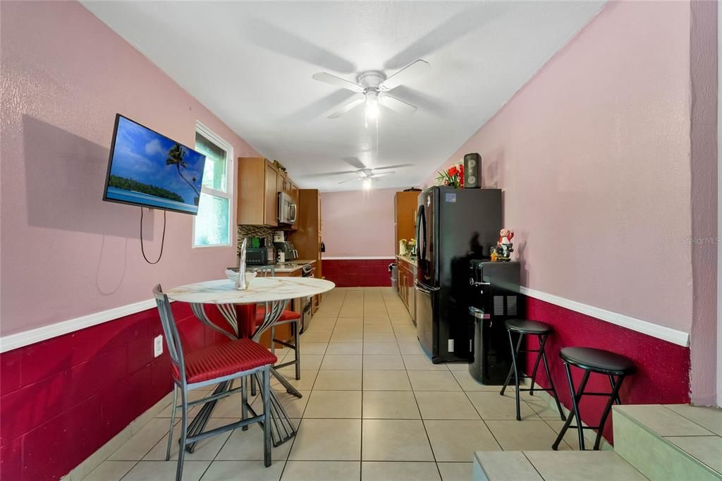 Right side of home; covered porch where outside laundry is located