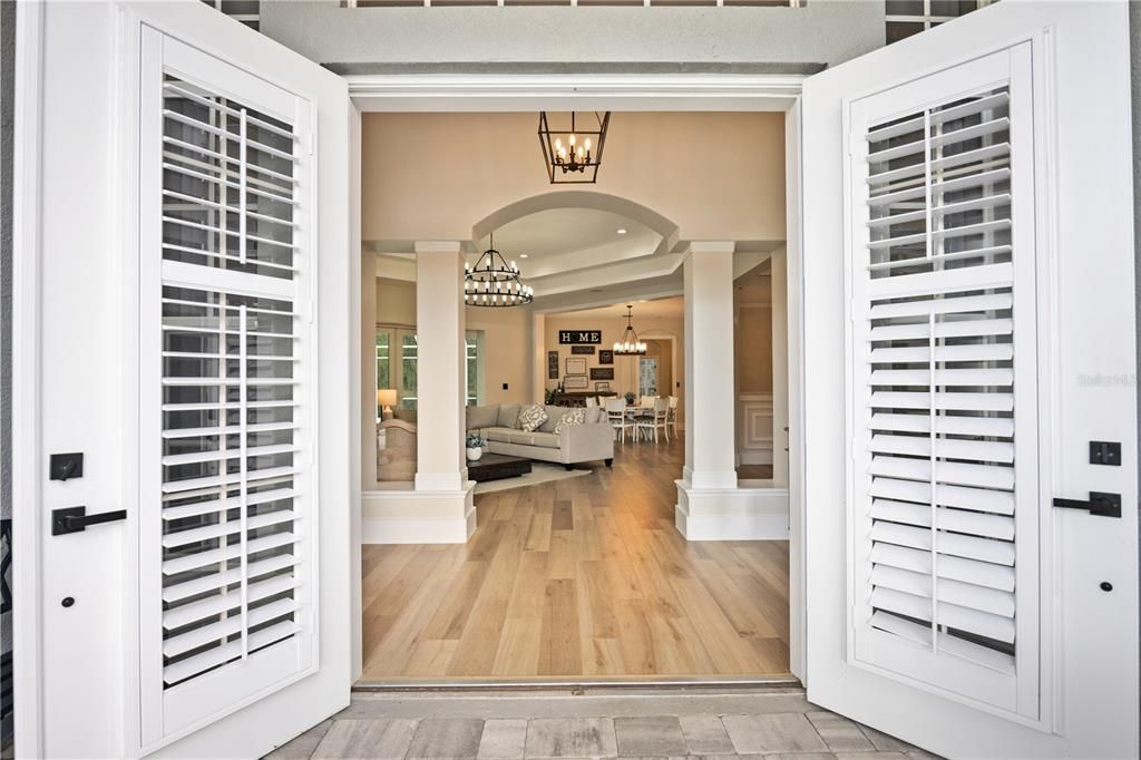 Your front doors are a set a lovely French doors with shutters delivering elegant style and privacy.
