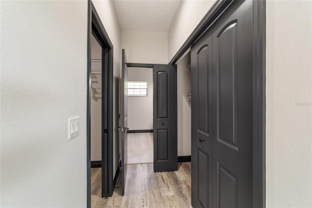 Primary Suite Hallway to Walk-in Closets