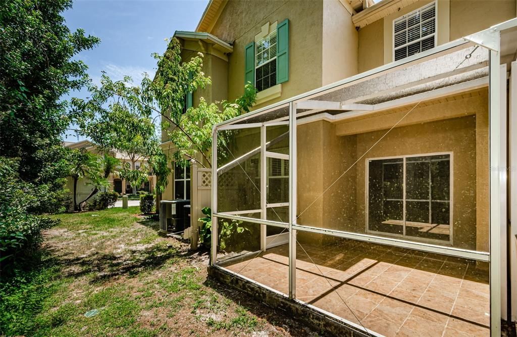 Screen enclosed back porch with privacy and preserve