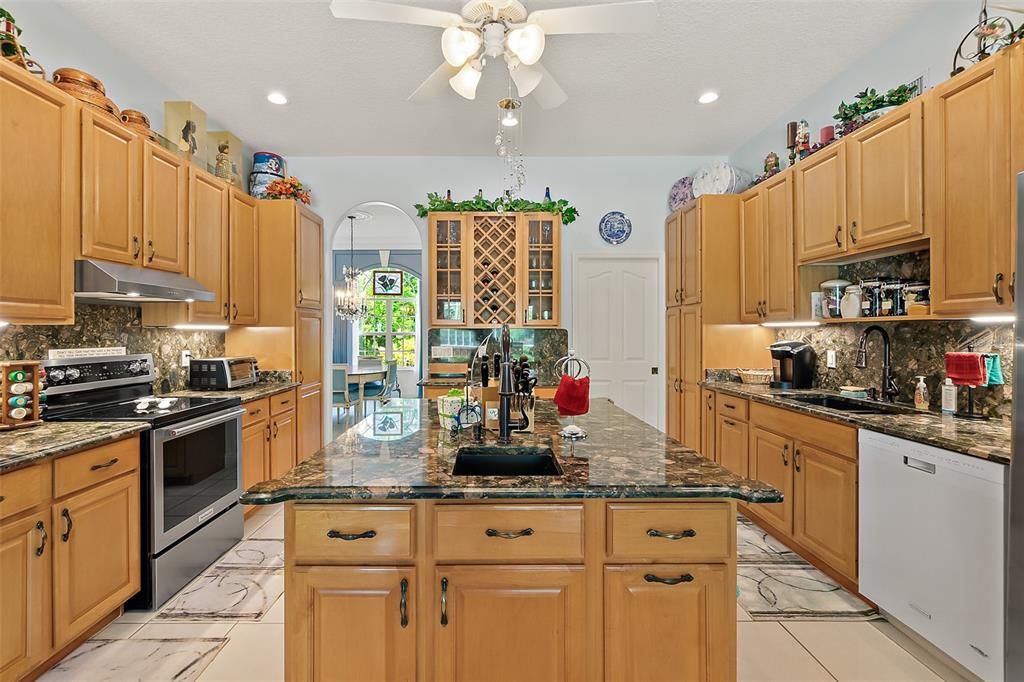 GRANITE COUNTERS, PULL-OUT SHELVING, TWO SINKS