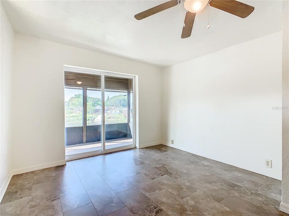 Second floor family room has sliding glass doors that open to the screened porch.