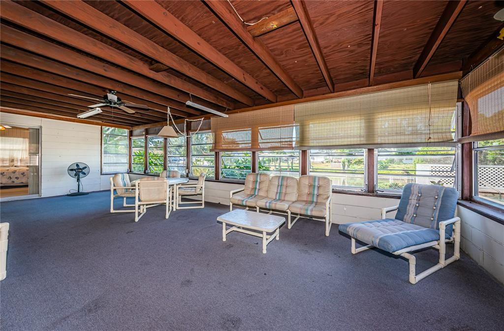 Florida room overlooks the waterfront.