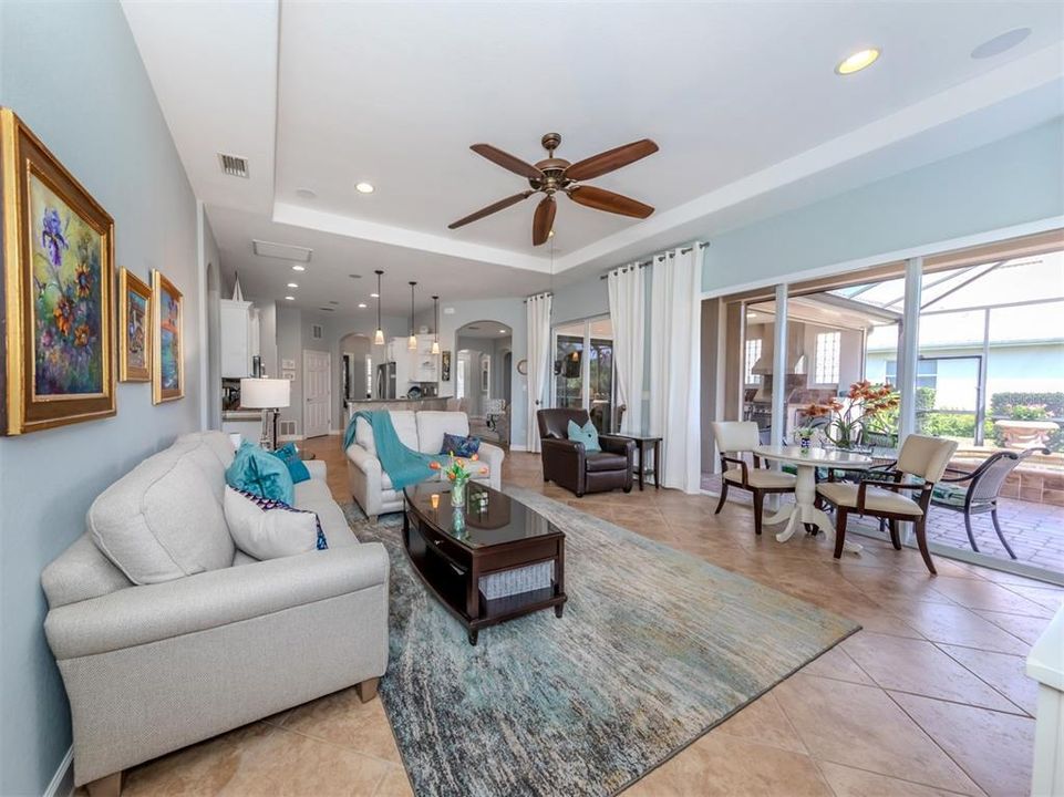 The family room features triple sliding glass door access to the lanai