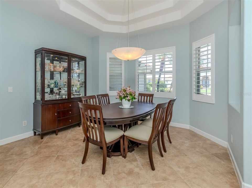 Formal dining room is near the kitchen for making serving a breeze