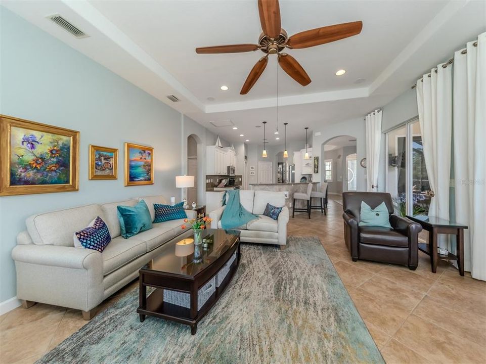 The large family room is the perfect place to gather for movie night after a day on the golf course or day at the beach!