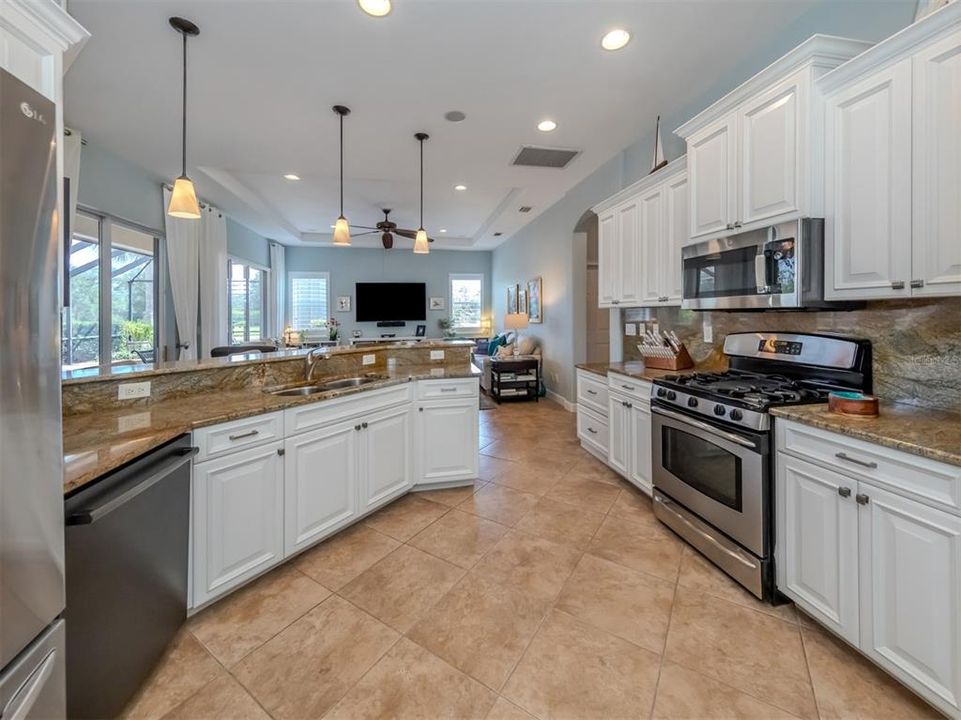 Solid wood cabinetry, stainless appliances and granite complete this kitchen!