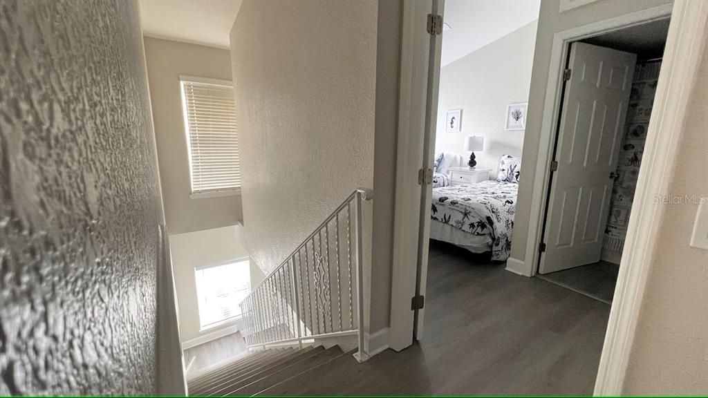 Upstairs view of bedroom and stairs