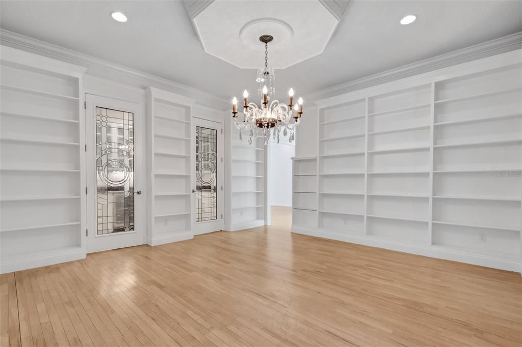 But a 2013-2014 home addition included this 16x17 dining room surrounded by book and display shelving . . .