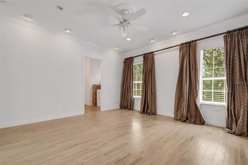 Let's circle back to the front entrance where the original dining room was recently used as a cozy TV room