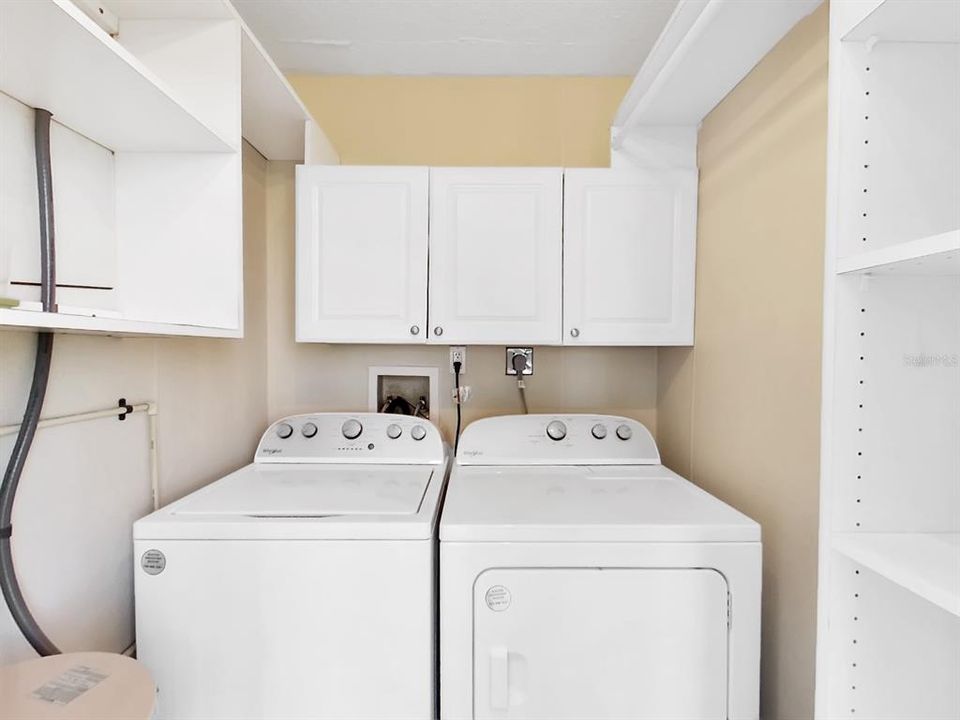 Laundry room with full size washer and dryer