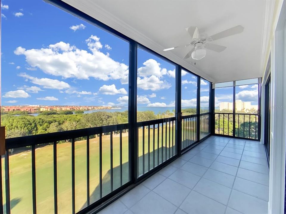 Lanai with view overlooking golf course and bay