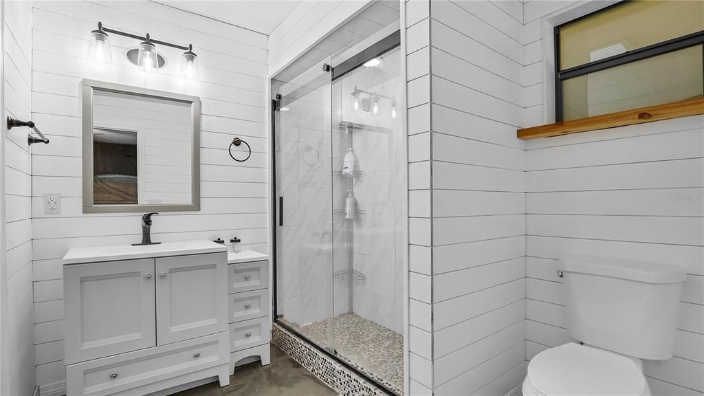 remodeled master bathroom with walk in closet