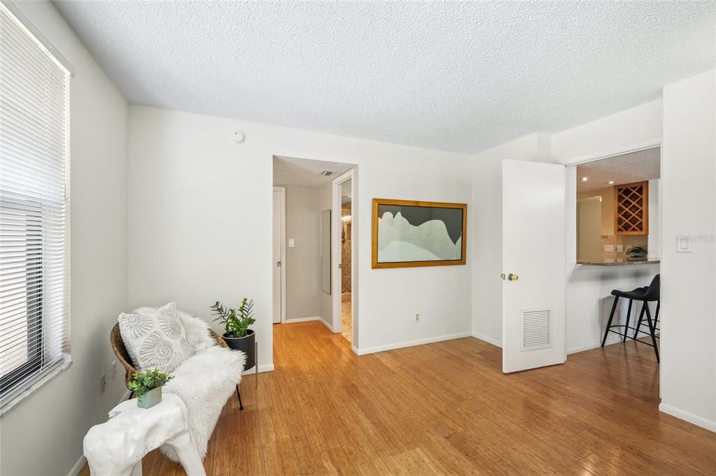 Primary bedroom with entrance to bathroom.