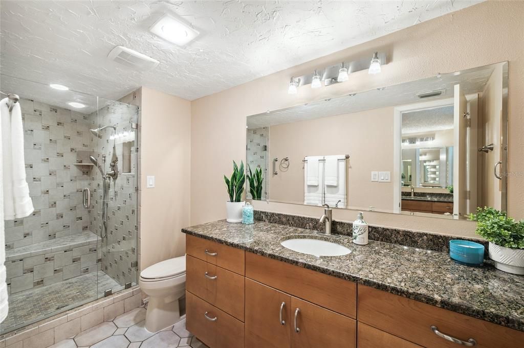 Primary Bathroom with double sinks. The second sink is outside the bathroom with its separate vanity.