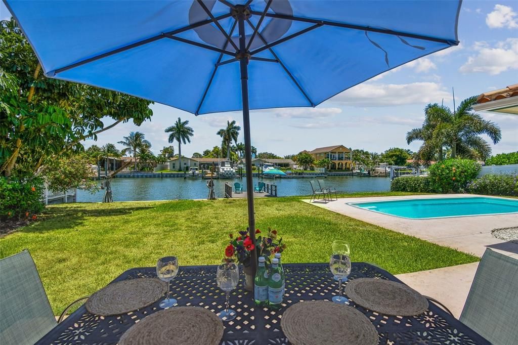 Wall of impact sliders in this Florida room to patio