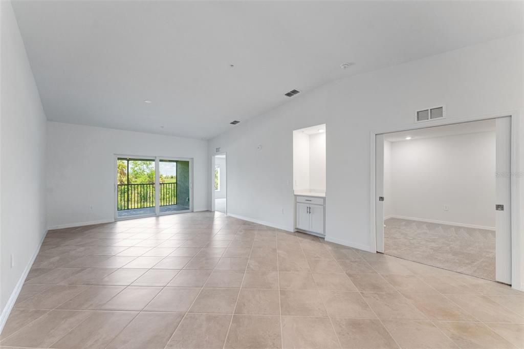 Livingroom with dry bar, Den with pocket doors and rear lanai