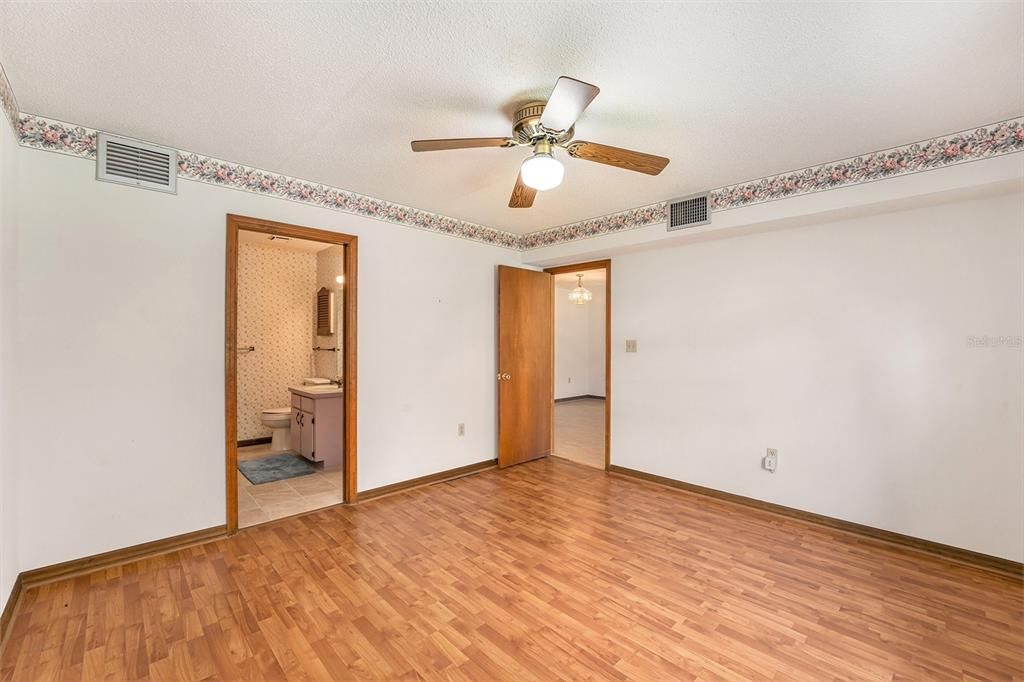 Archway from livingroom to kitchen and entry door from carport