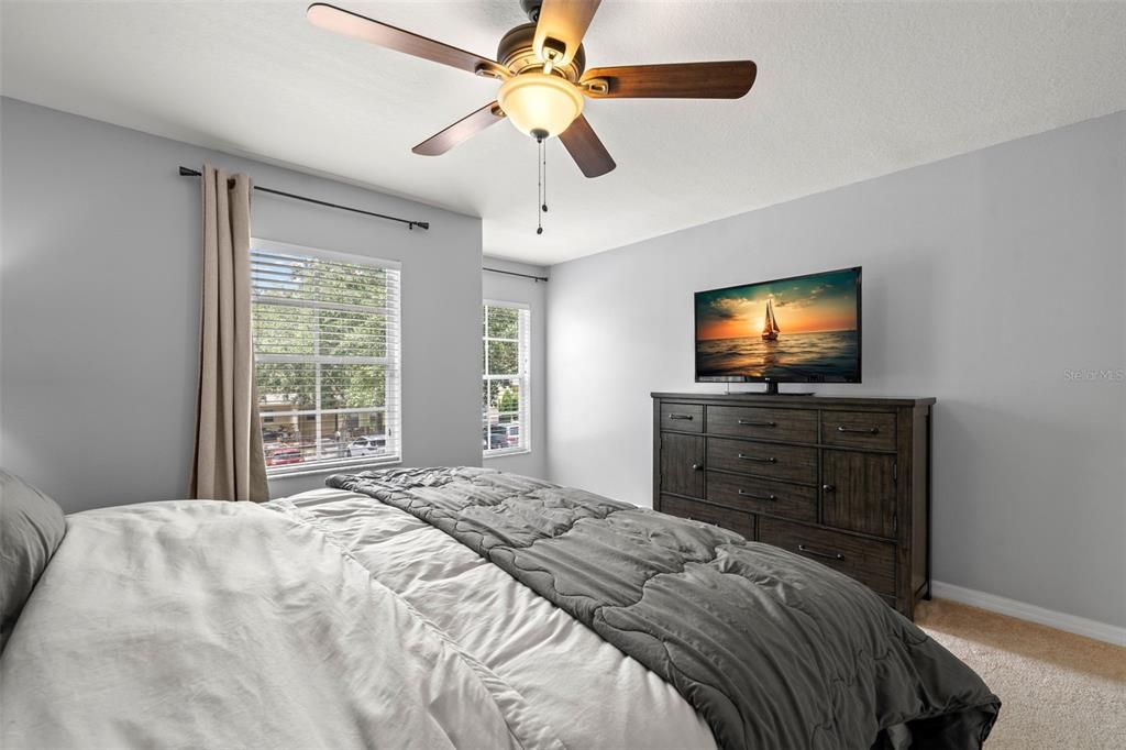 Primary bedroom with ceiling fan