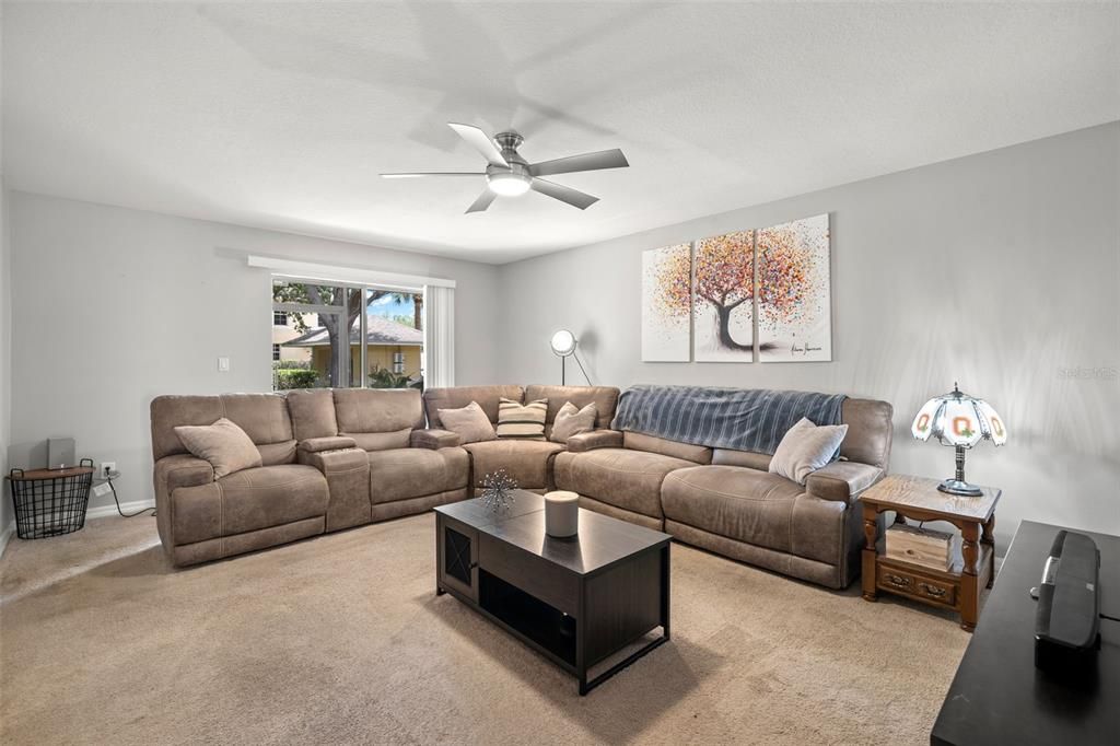 Spacious living room with sliders to back patio