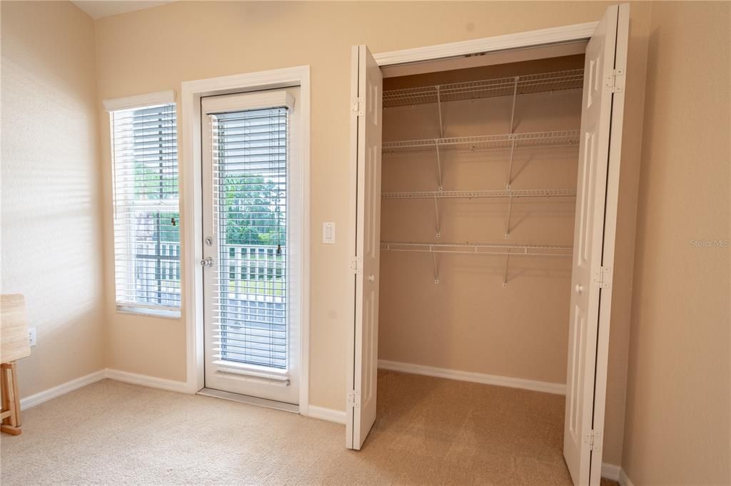 Bathroom 2 features ceramic tile flooring, a mirrored vanity with storage and a tiled tub with shower.