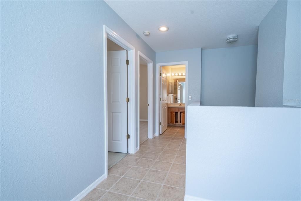 A hallway ensures privacy in this thoughtfully designed split floor plan.