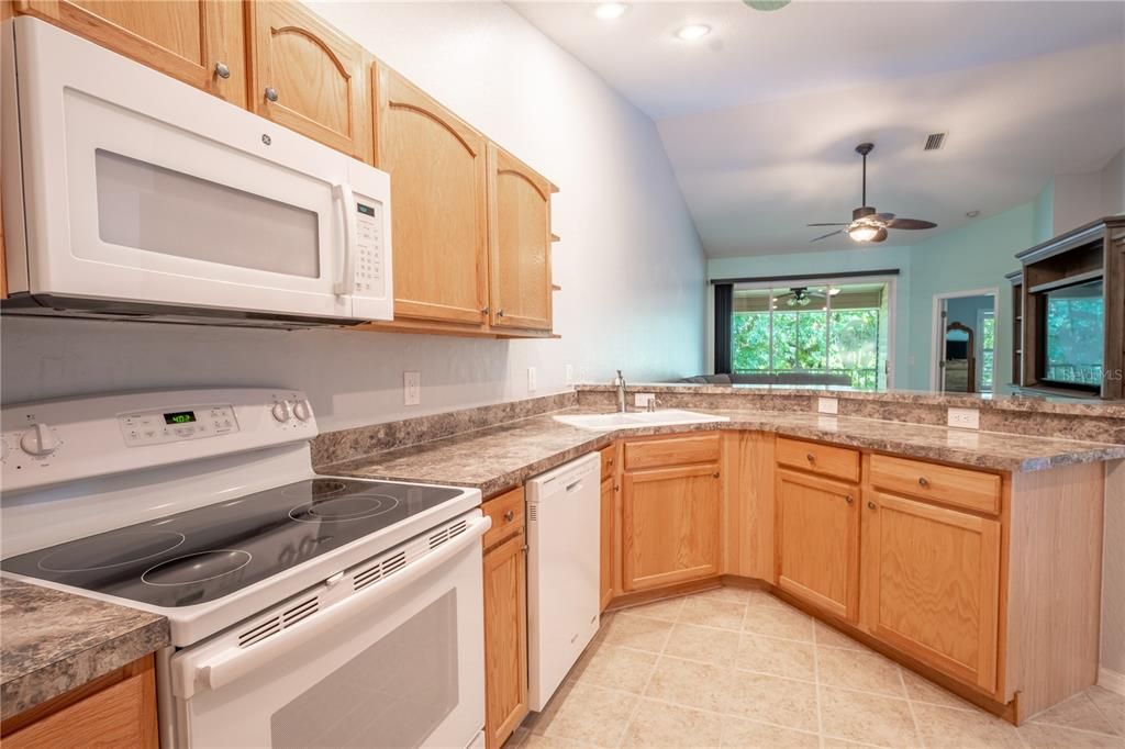 The kitchen features a french door refrigerator with water dispenser and cabinet and counter ideal for your coffee bar.