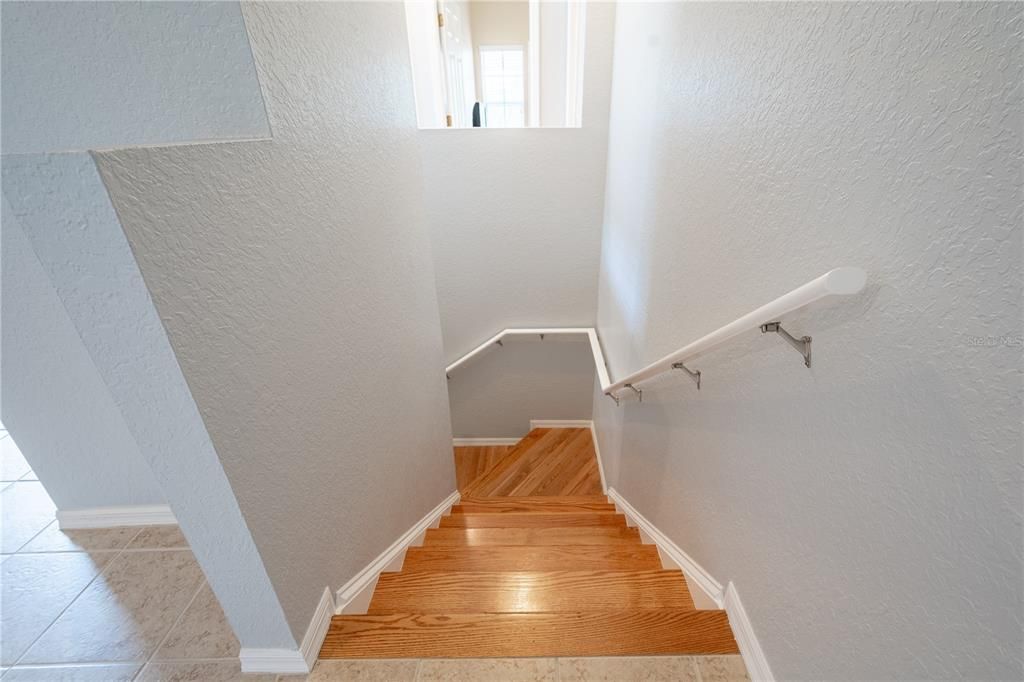 The stair feature wood flooring.