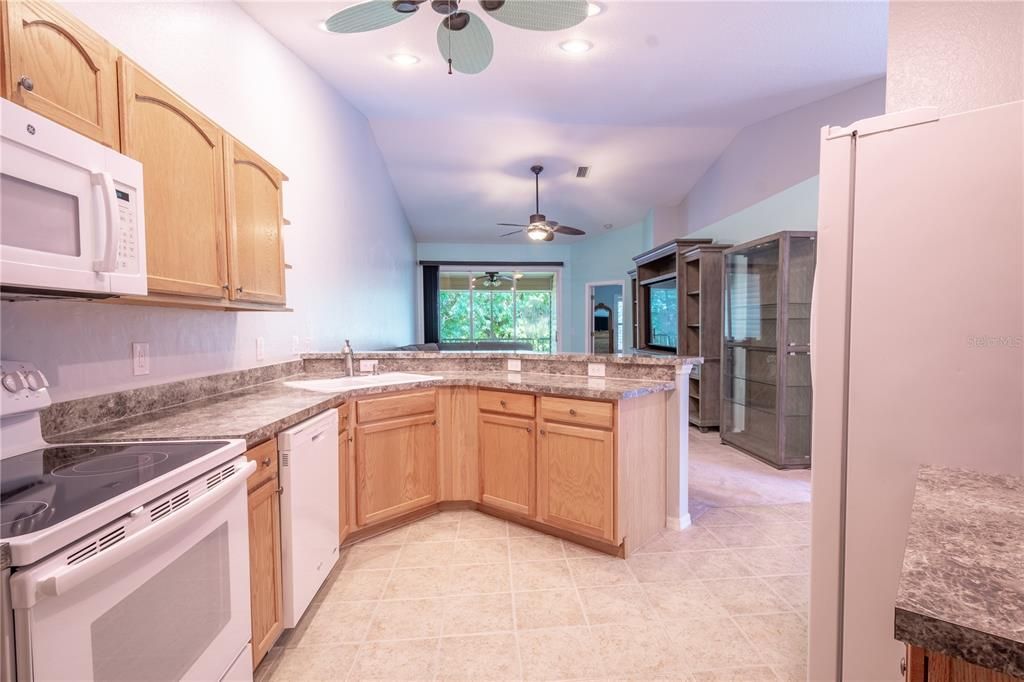 The laundry room is equipped with hook-ups for YOUR washer dryer. It also features wood cabinets for additional storage.